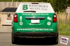 Custom designed, printed, and laminated partial vinyl wrap installed
